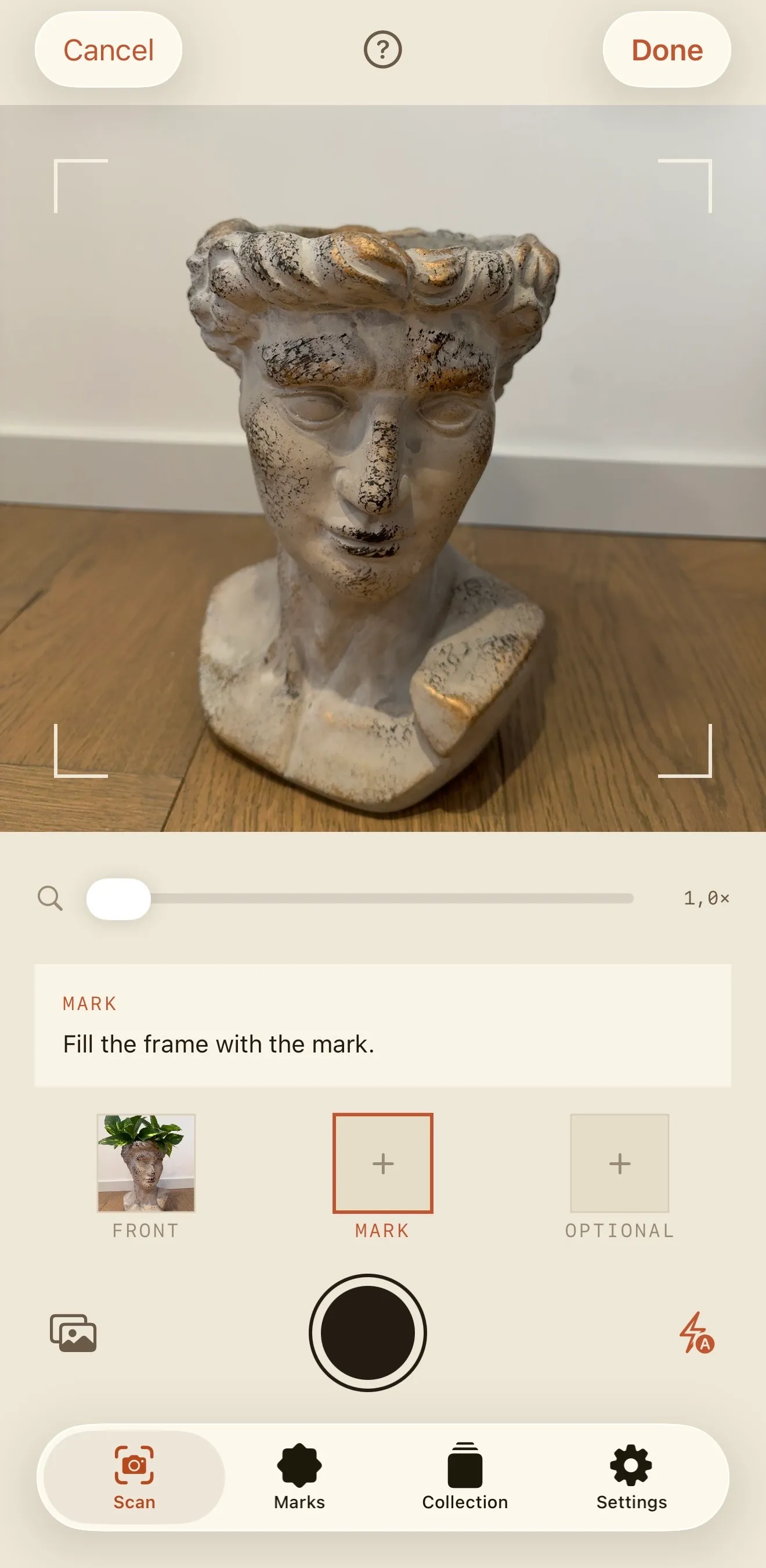 Capturing the second frame: the viewfinder on a stone bust, corner brackets, a zoom slider, and a strip below showing the front photograph taken and the mark being asked for next.